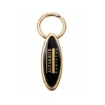 Black oval metal keychain with polished gold finish by ESS9.pk