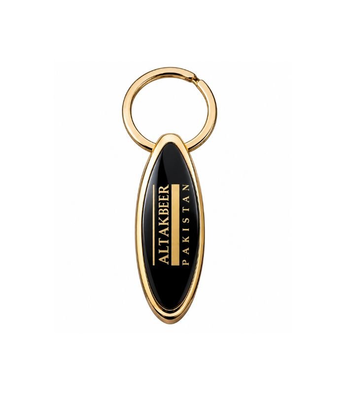 Black oval metal keychain with polished gold finish by ESS9.pk