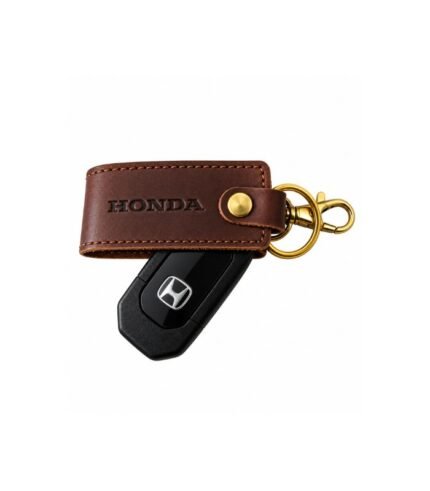 Brown leather keychain with decorative metal charm by ESS9.pk